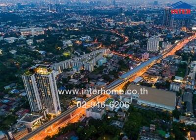 Aerial view of city buildings and streets at dusk