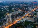 Aerial view of city buildings and streets at dusk