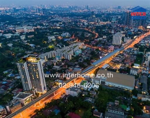 Aerial view of city buildings and streets at dusk