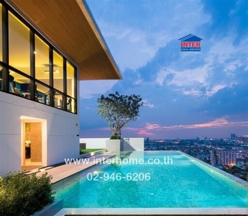 Modern building with a rooftop infinity pool overlooking the city