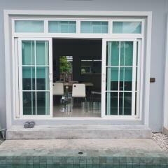 Sliding glass doors with view of indoor dining area