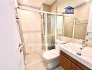 Modern bathroom with glass shower enclosure and vanity