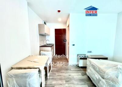 Modern studio apartment with kitchenette and furnished living area