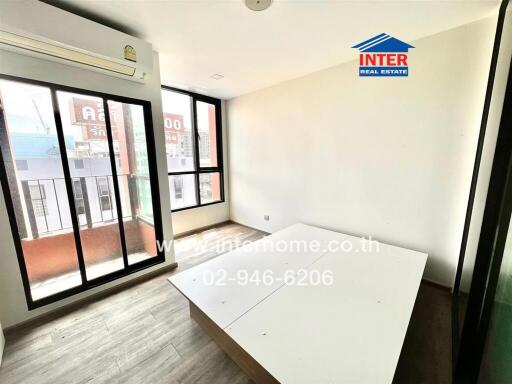 Bright bedroom with large windows and a platform bed