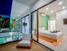 Modern bedroom with large glass walls, balcony view, and minimalistic design