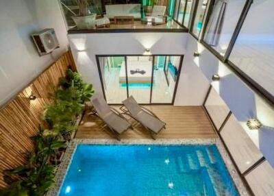 Modern outdoor lounge area with pool