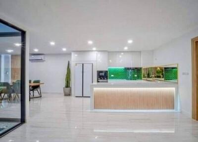 Modern kitchen with green backsplash