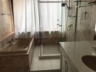 Bathroom with bathtub and walk-in shower