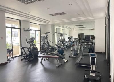 Modern fitness center with various gym equipment