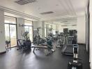 Modern fitness center with various gym equipment