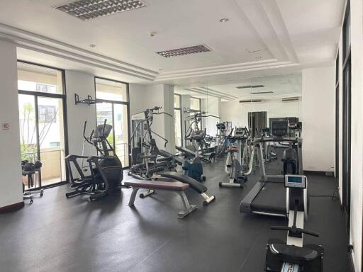 Modern fitness center with various gym equipment