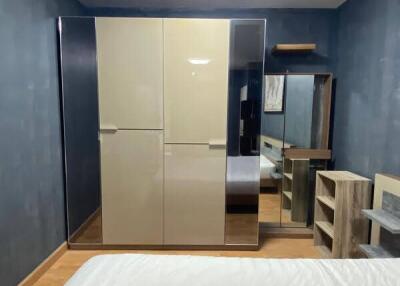 Modern bedroom with wardrobe and mirror