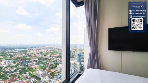 High-rise bedroom with city view