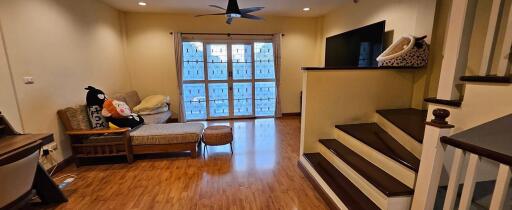 Cozy living room with seating area and TV