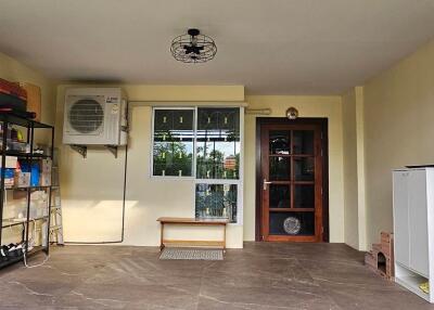 Organized utility area with storage shelves and air conditioning unit