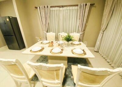 Elegant dining room with set table and chairs