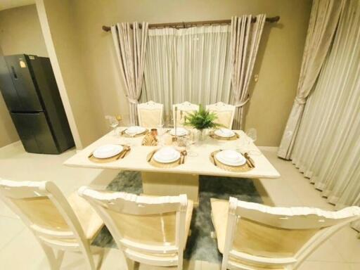 Elegant dining room with set table and chairs