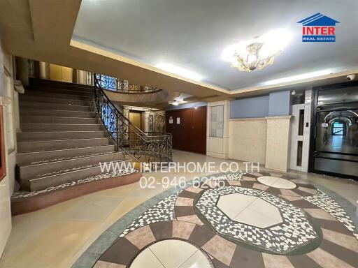 Building entrance with stairs and decorative flooring