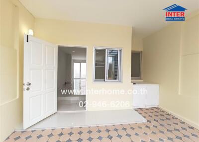 House entrance with door, window, and tiled floor