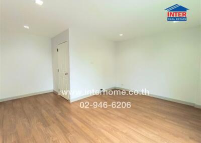 spacious empty room with wooden floor