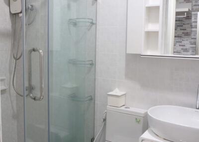 Modern and clean bathroom with glass shower enclosure