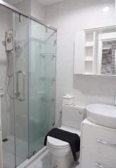 Modern and clean bathroom with glass shower enclosure