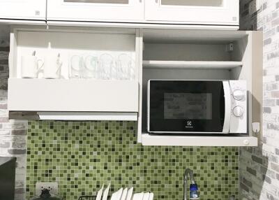 Modern kitchen with green mosaic backsplash
