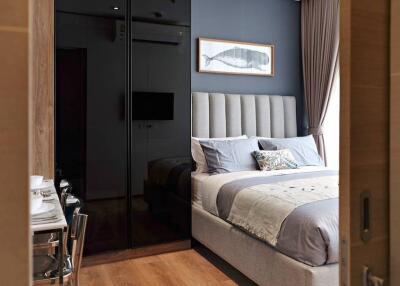 Modern cozy bedroom with large bed and wardrobe