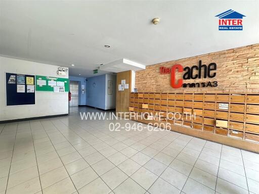 Building lobby with mailboxes, bulletin boards, and signage