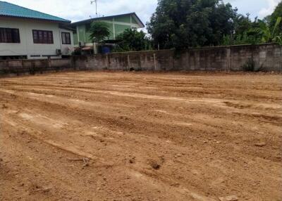 Empty plot of land with adjacent residential buildings