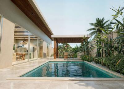 Outdoor pool area with modern design and greenery