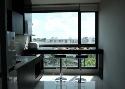 Modern kitchen with large windows and view