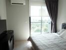 Modern bedroom with balcony and natural light