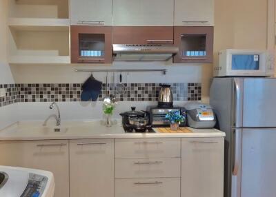 Modern kitchen with stainless steel appliances and stylish backsplash