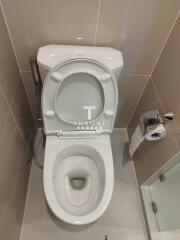 clean bathroom with toilet and paper holder