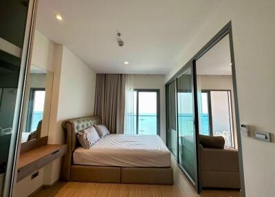 Modern bedroom with ocean view and balcony