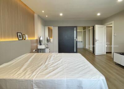 Spacious bedroom with modern design and large wardrobe