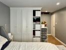 Spacious bedroom with built-in wardrobes and storage