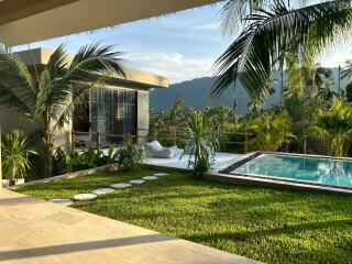 Outdoor living area with a private pool and garden