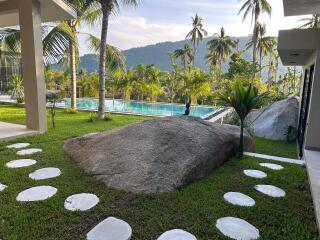 Luxurious outdoor area with a pool and scenic mountain view