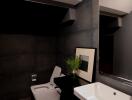 Modern bathroom with dark tiles and stylish fixtures