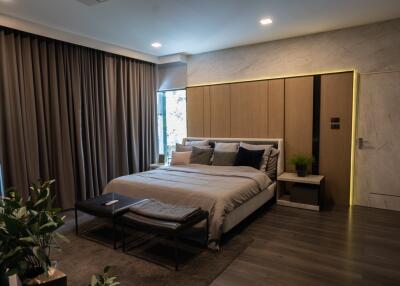 modern bedroom with large bed and accent lighting