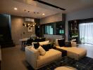 Stylish modern living room with a sectional sofa, dining area, glass table, and contemporary lighting