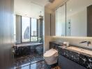 Modern bathroom with marble flooring, glass shower, and city view