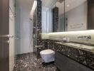 Modern bathroom with glass shower, wall-mounted toilet, and black marble countertop