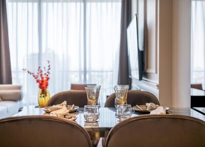 Elegant dining area with glass table setting