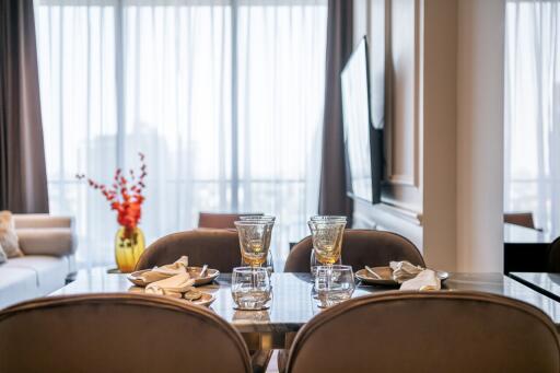 Elegant dining area with glass table setting