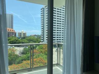 View from balcony with buildings and trees