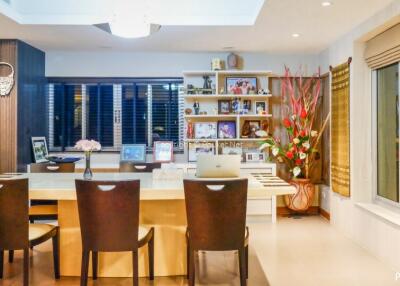 Modern dining area with large table and seating