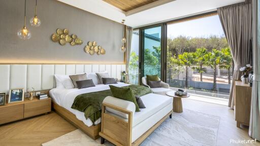 Modern bedroom with large windows and outdoor view